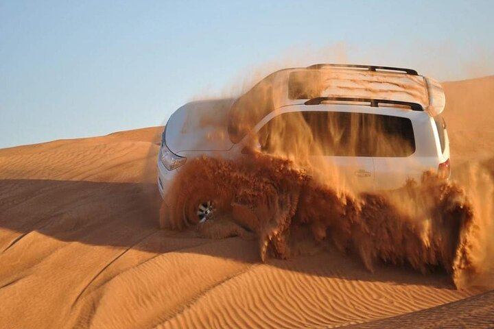 Experience the rush of dune bashing as you conquer the golden sands surrounded by stunning desert landscapes that transform with the setting sun. An unforgettable adventure awaits in Dubai!